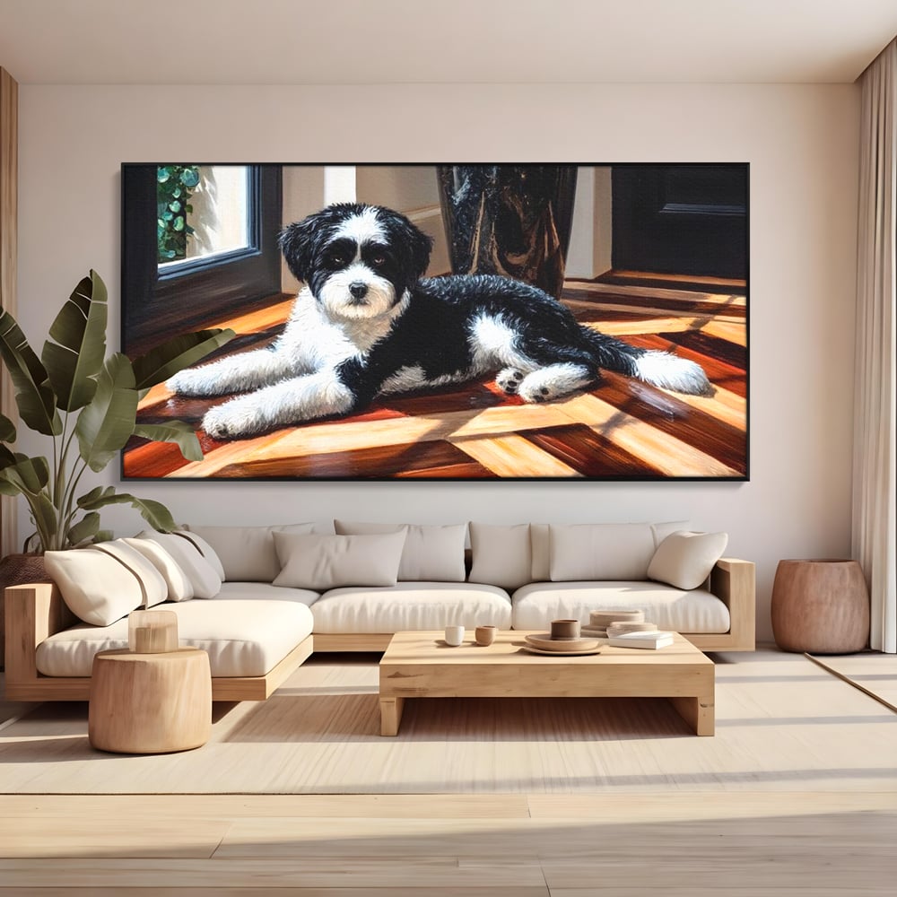 Tablou canvas cu tablou canvas cu catel negru cu alb, in rama de aluminiu negru, pe perete intr-un living